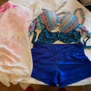 swim shorts with two tops. beach towel, cover up